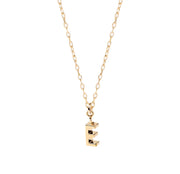 Close-up of Petite Glow Initial Necklace with the letter E, finished in 18K gold plating and suspended on an adjustable anchor chain.